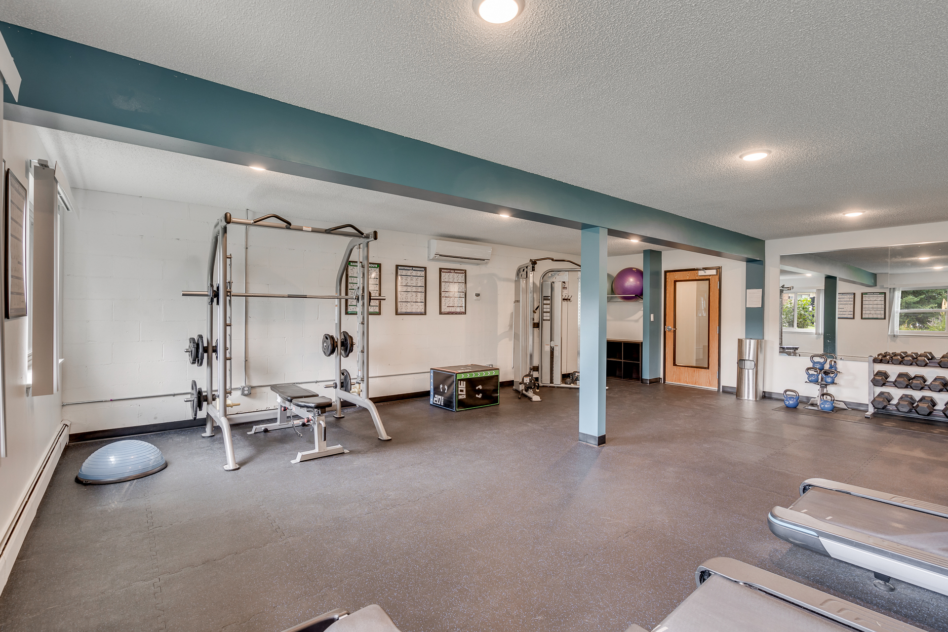 Free Weights In Fitness Center At Sumter Green Apartments In Crystal, MN