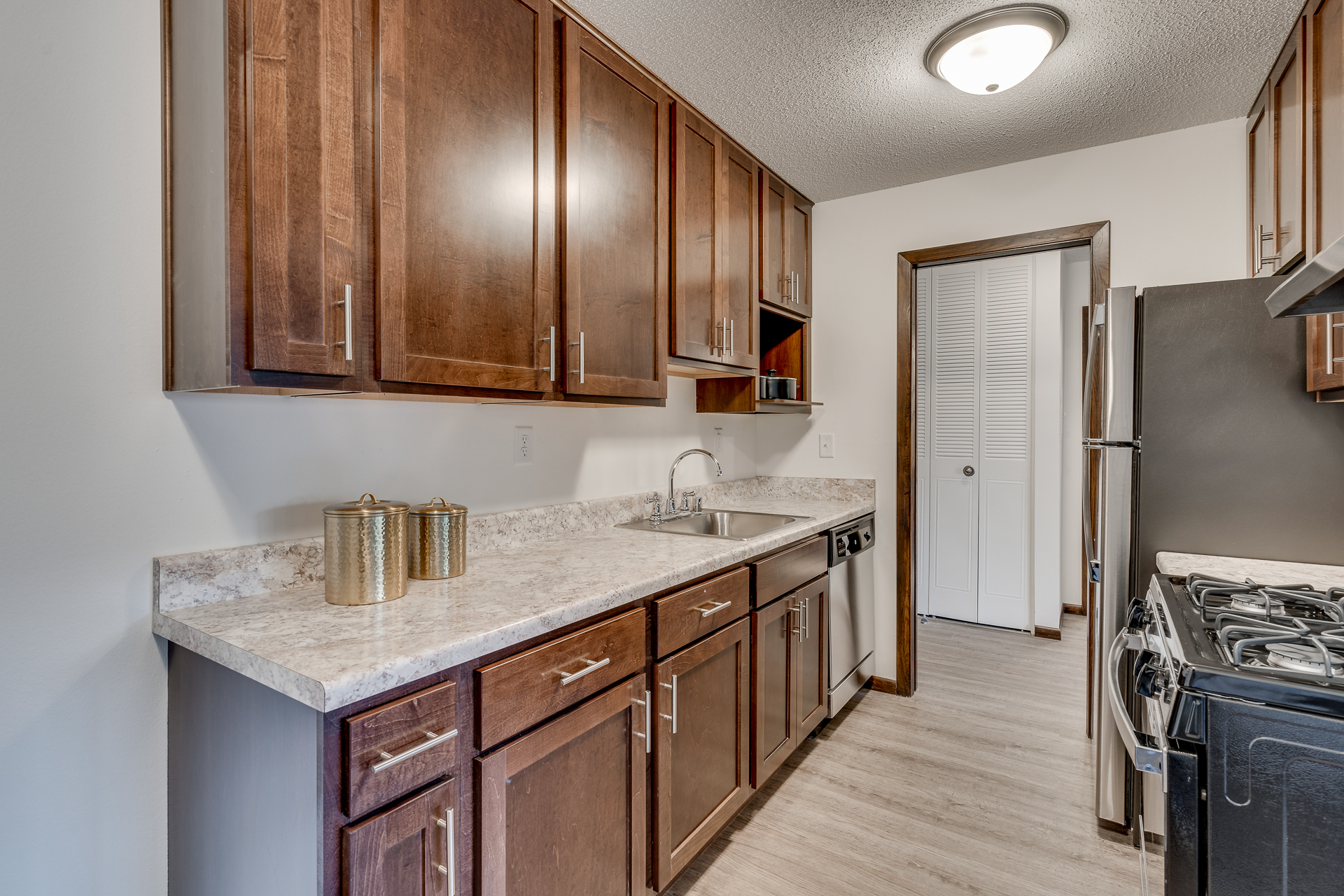 Model Unit Kitchen At Sumter Green Apartments In Crystal, MN
