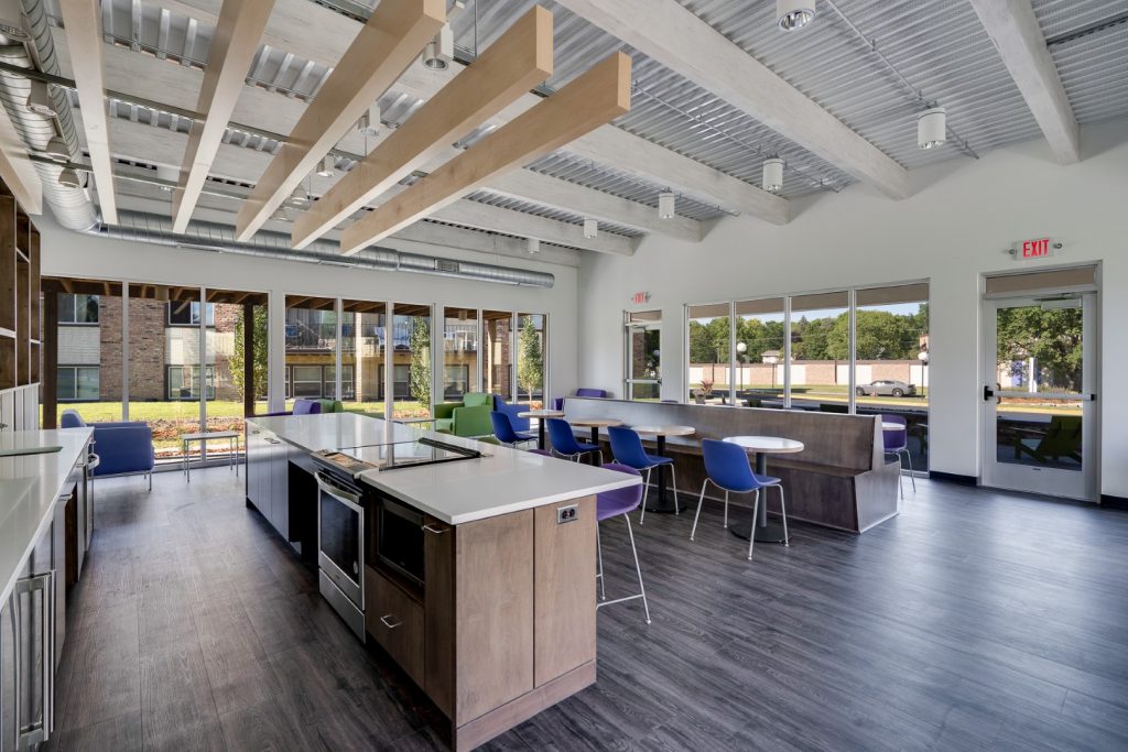 Kitchen In Clubhouse At Sumter Green Apartments In Crystal, MN