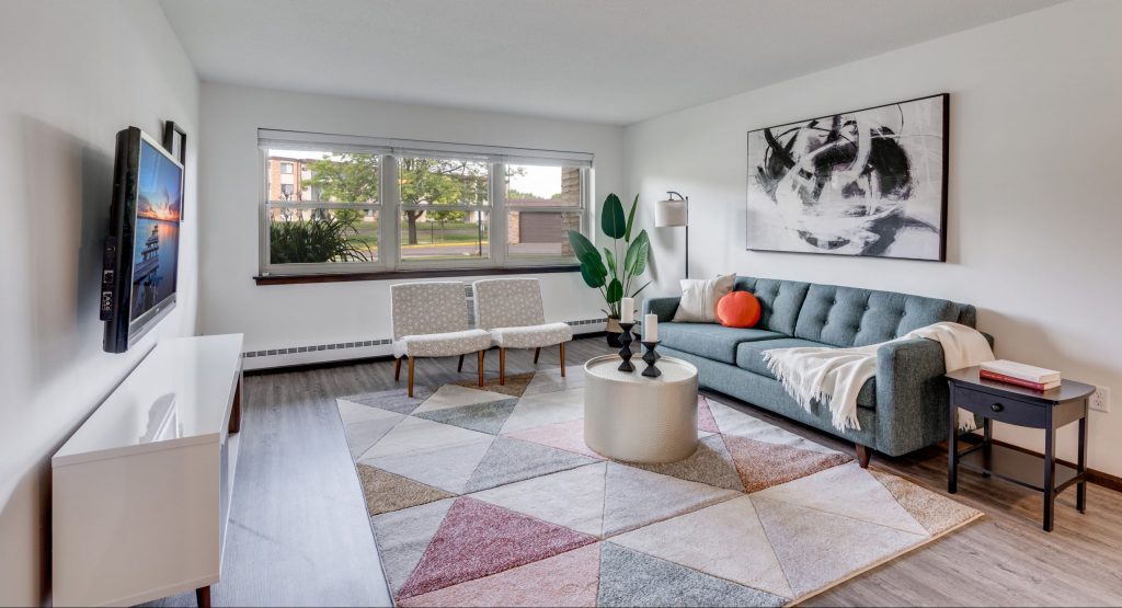 Furnished Apartment Living Room At Sumter Green Apartments In Crystal, MN