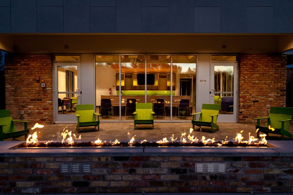 Patio Oasis With Fir Pit At Sumter Green Apartments In Crystal, MN