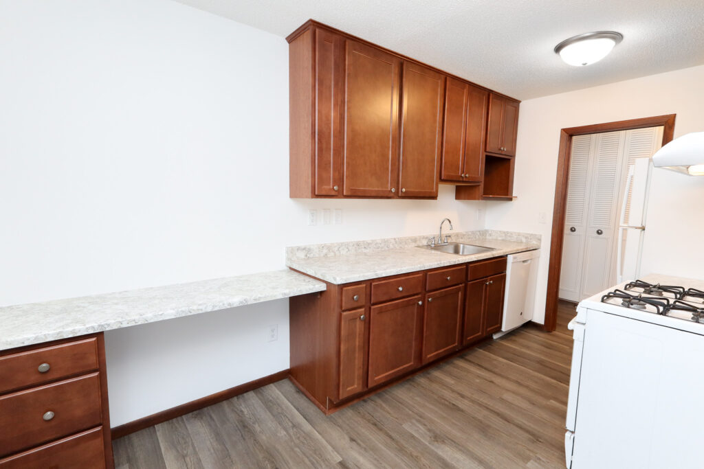 kitchen with brown cabinets and white appliances